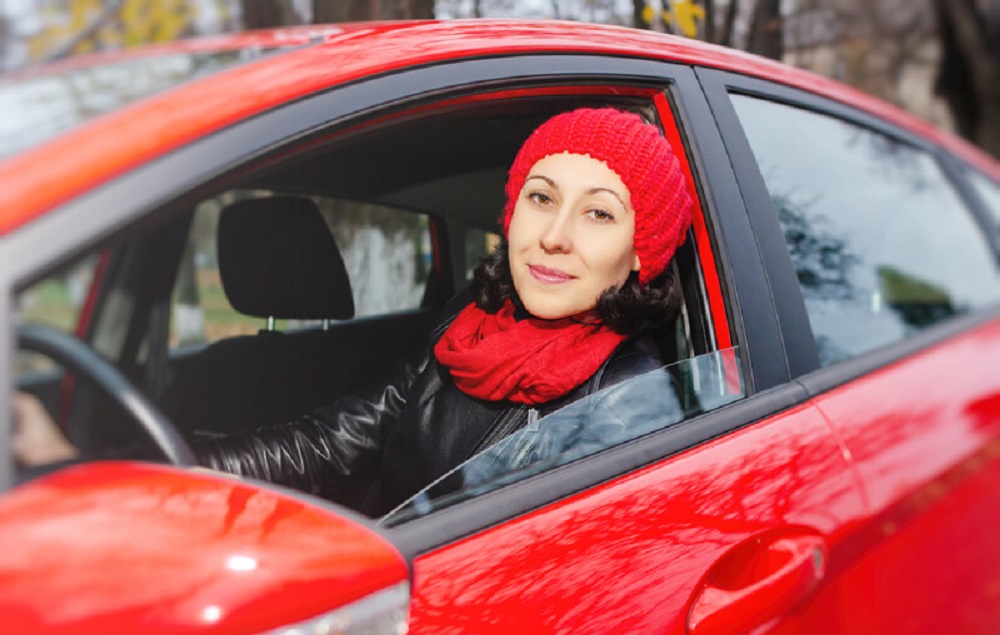 Girl in red car